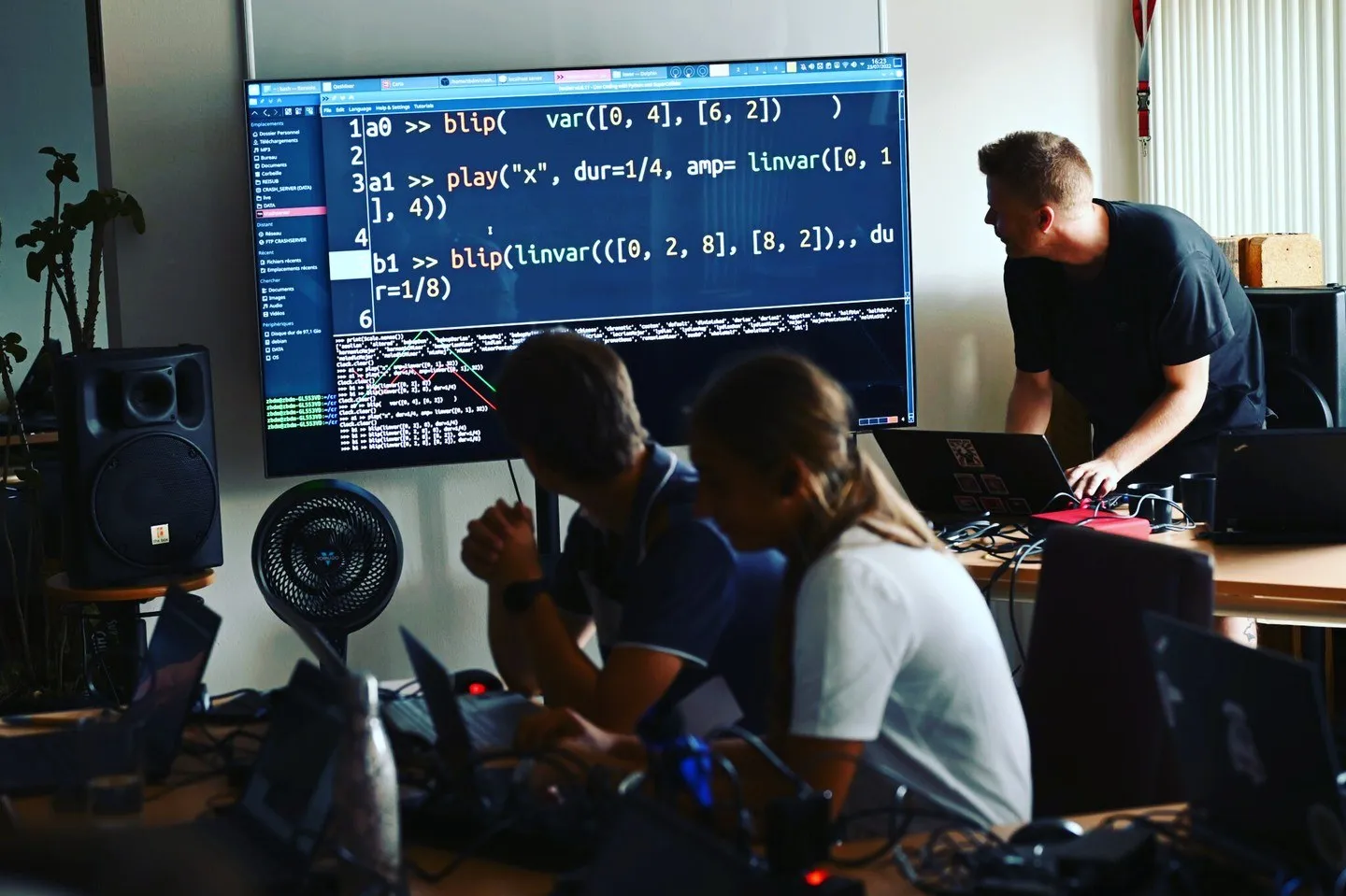 A live-coding workshop in Tübingen, laptops and code on the screen